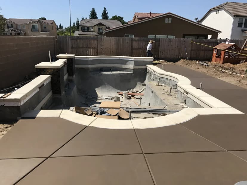 Pool under construction with concrete surround
