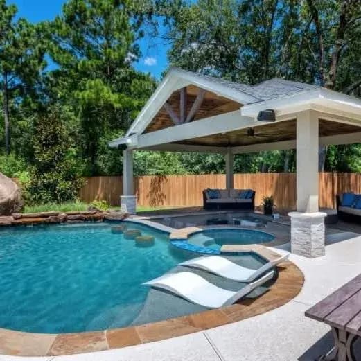 Pool deck with pergola and spa area