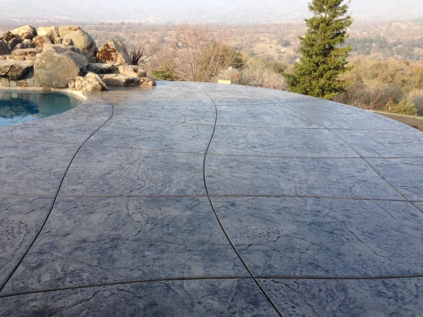 Pool with stained concrete surround