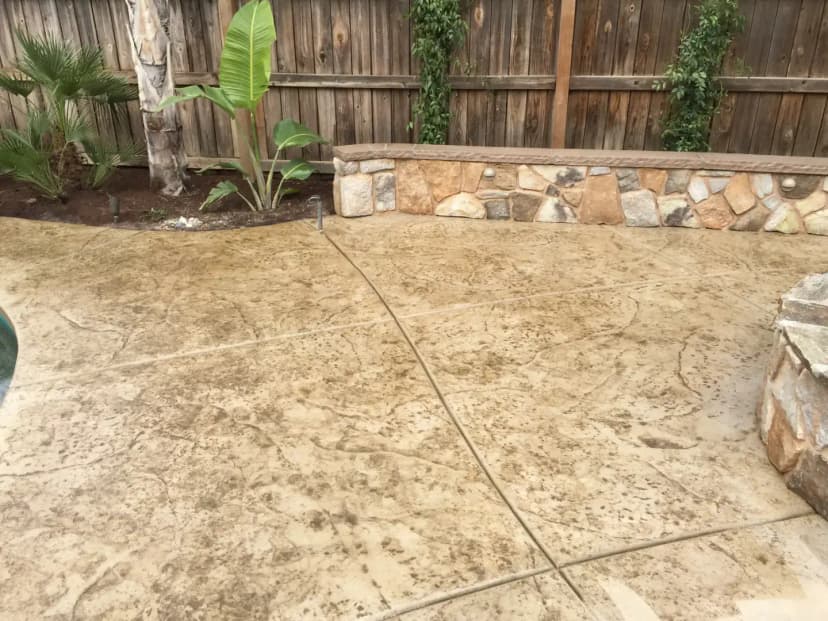 Patio with stamped concrete and wall