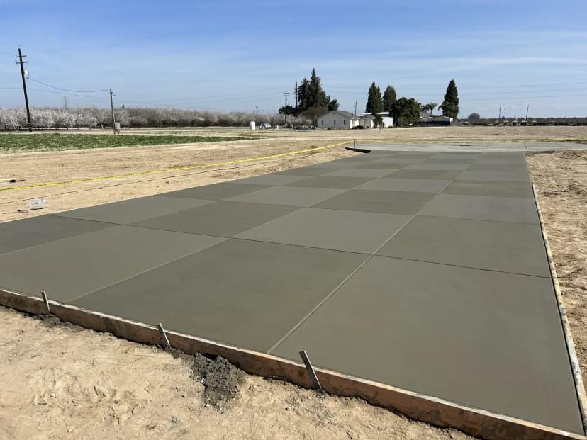 Large concrete RV pad or driveway in construction phase