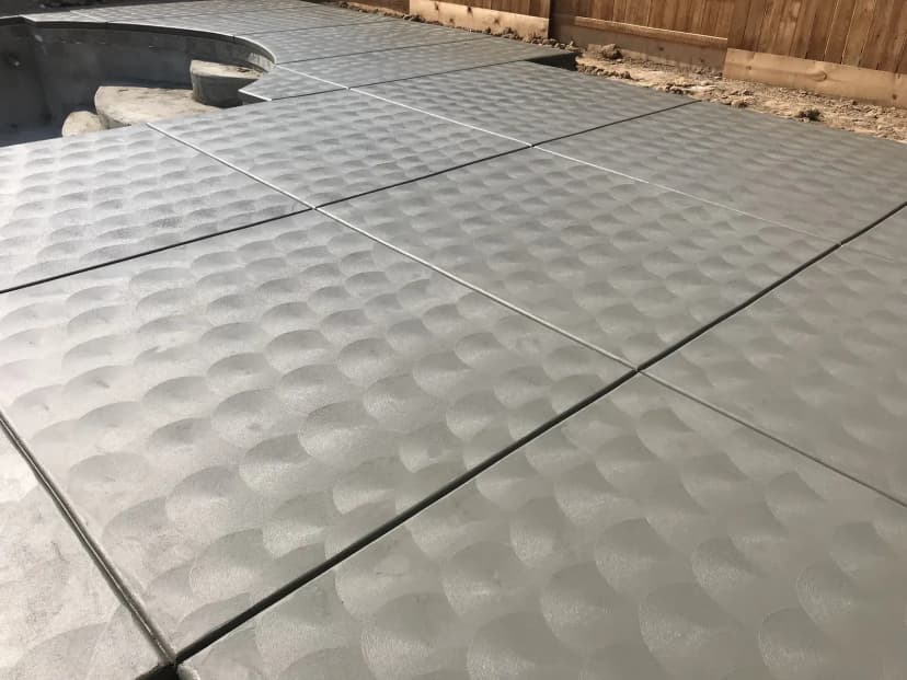 Decorative pool deck concrete with ripple texture pattern