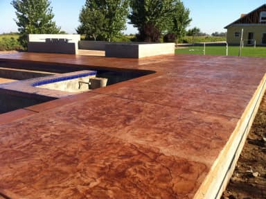 Stamped decorative concrete patio with fire pit feature