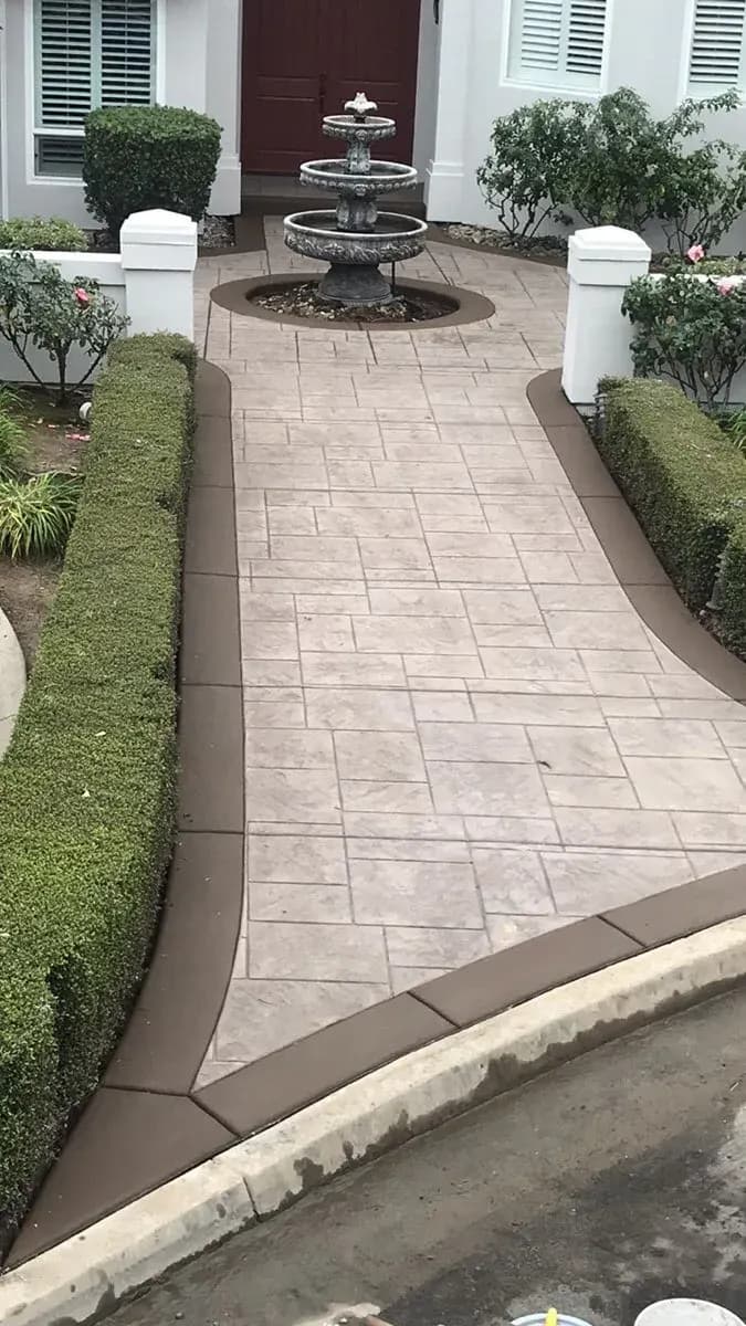 Decorative concrete entry courtyard patio with fountain