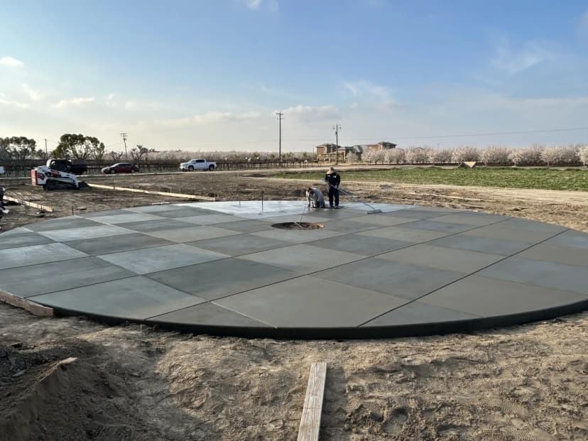 Large concrete flatwork patio under construction