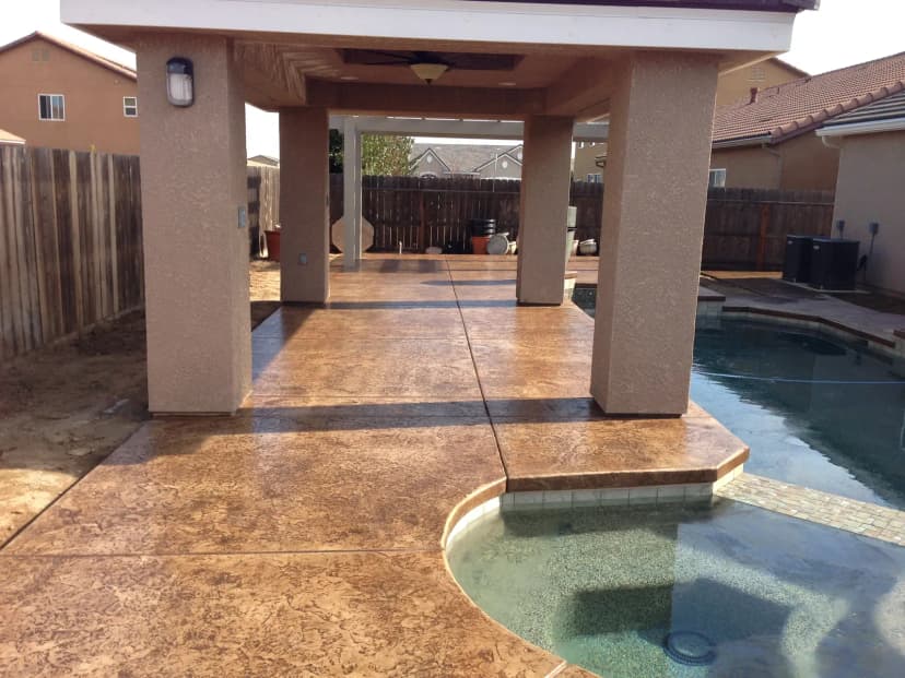 Finished pool with decorative concrete decking