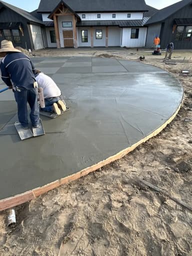 Large curved concrete patio during construction