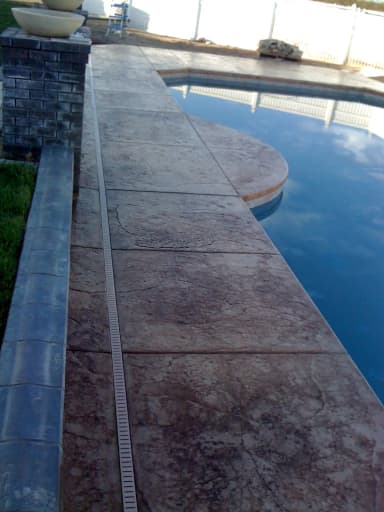 Backyard patio with stamped concrete furniture