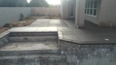 Concrete patio with spa area under construction.