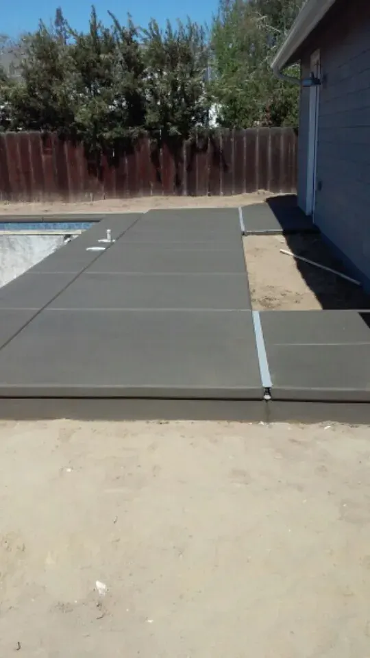 RV pad with curved concrete edge in progress