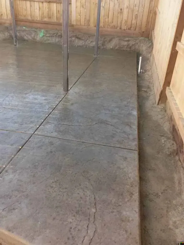 Wet concrete patio under covered structure