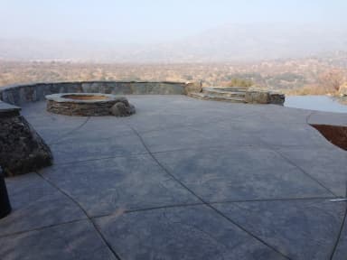 Mountain view patio with fire pits and concrete