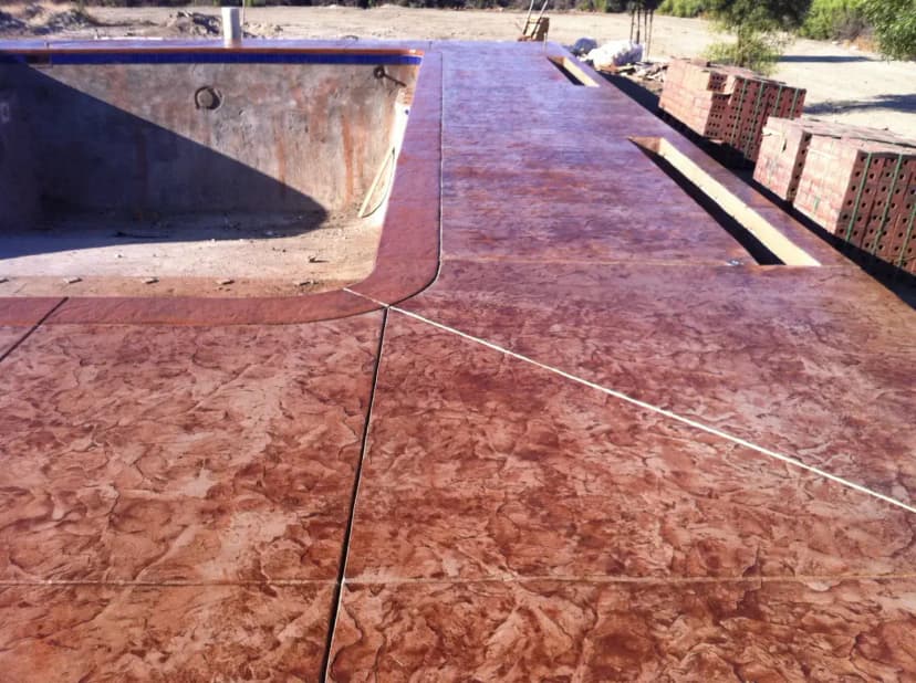 Colored stamped concrete patio finish