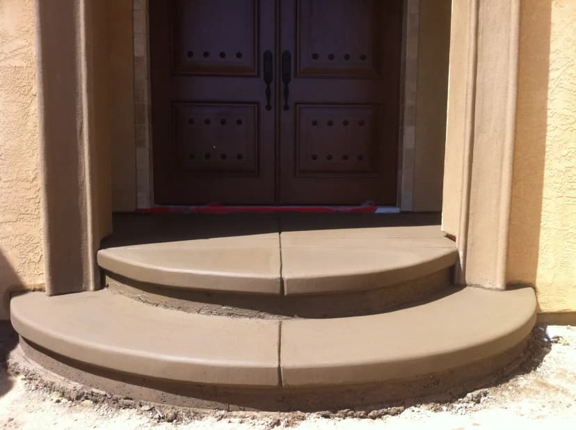 Curved concrete seating landing at home entrance