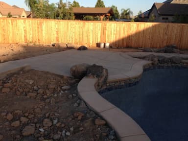 Backyard patio construction with decorative concrete