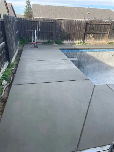 Pool deck with spa and decorative stamped concrete