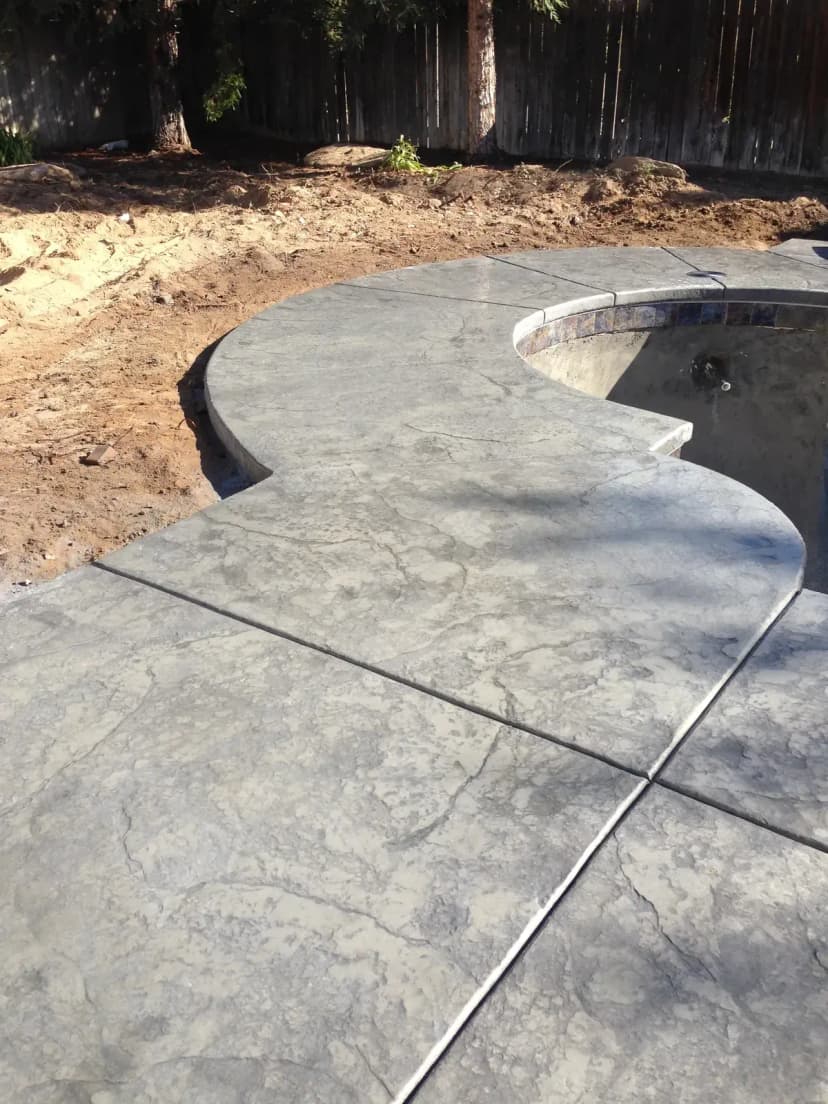 Fresh concrete patio with saw-cut scoring pattern