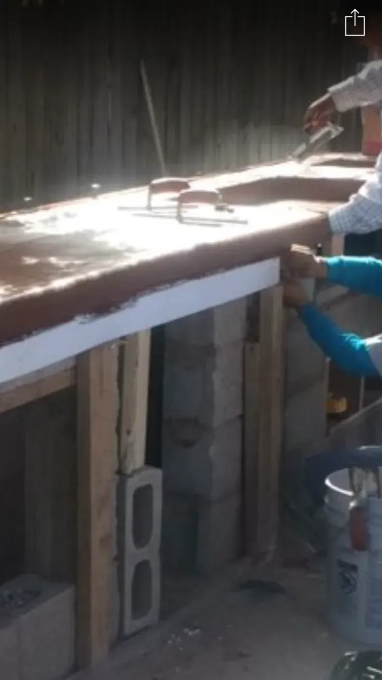 Concrete construction work in progress with retaining wall