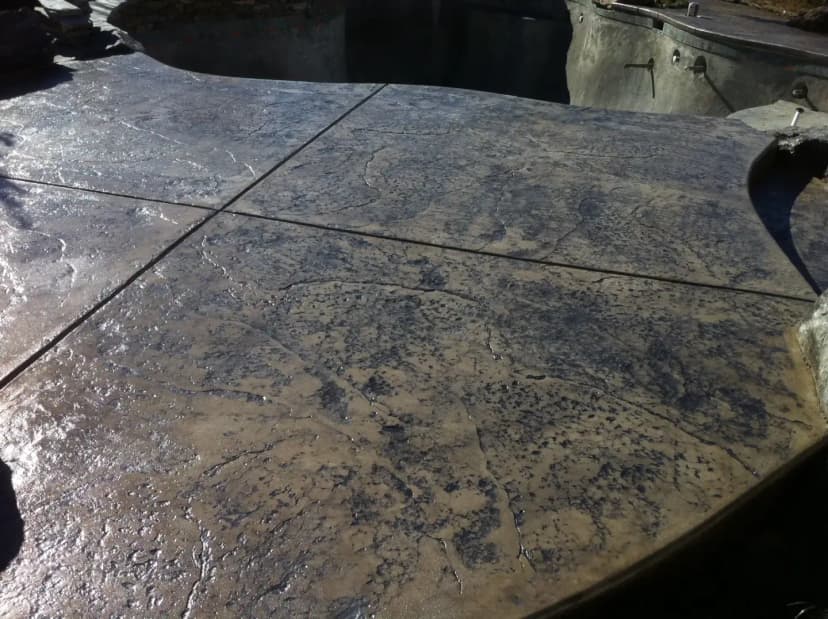 Stained concrete surface with exposed texture