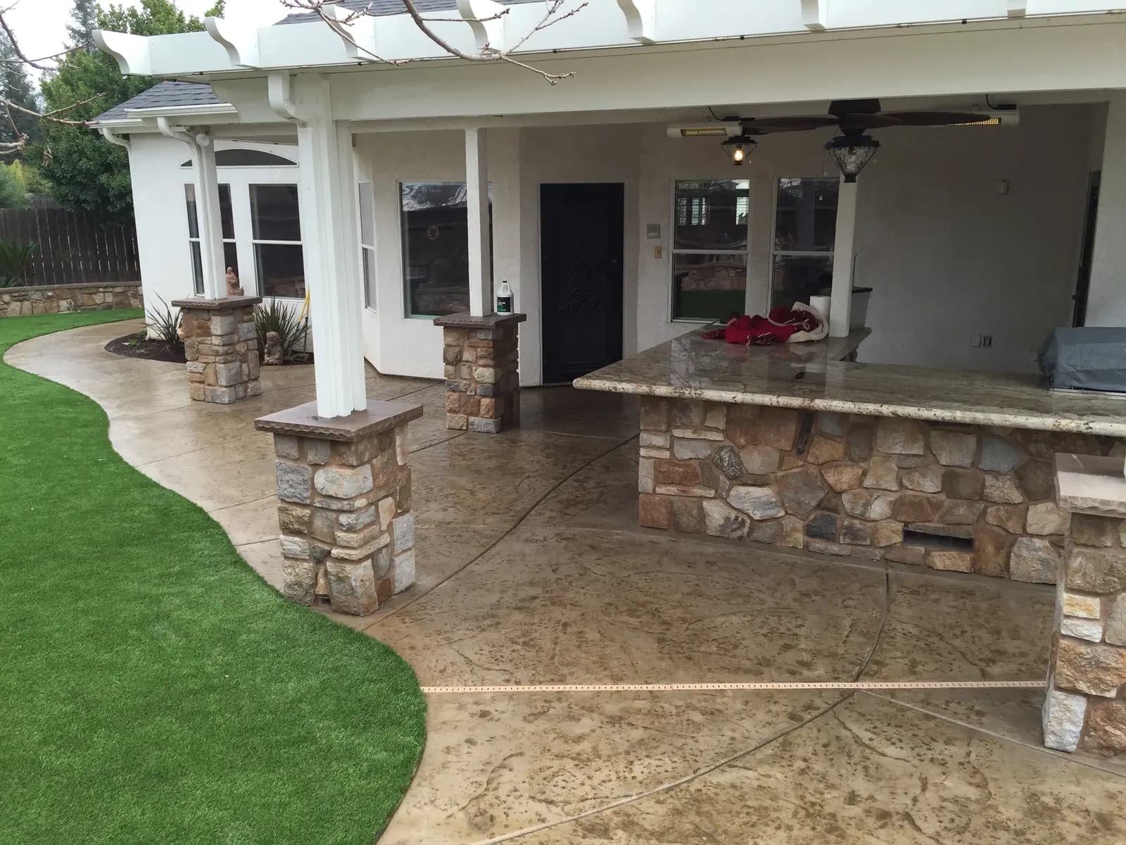 Covered patio with pergola and concrete