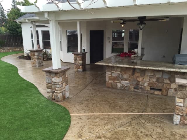 Covered patio with pergola and concrete